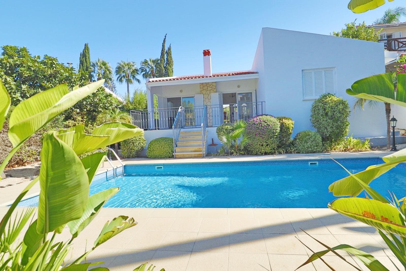 Villa exterior with private pool and tropical garden